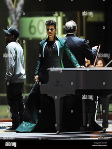 Alicia Keys filming her latest music video "It's On Again" for the lead track from the upcoming "The Amazing Spider Man 2" soundtrack. The singer teamed up with oscar winner Pharrell Williams and hip hop artist Kendrick Lamar. The trio was seen dancing around in the middle of downtown Los Angeles and Alicia was a piano wearing a long green coat for the shoot  Featuring: Alicia Keys,Kendrick Lamar Where: Los Angeles, California, United States When: 26 Mar 2014 Stock Photo - Alamy