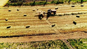 Tractor Working in the Agriculture Field Aerial View