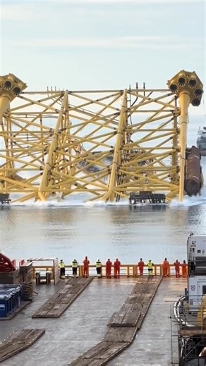 Offshore Platform Jacket Launching is a critical stage in installing fixed offshore oil and gas structures. The jacket is the large steel lattice framework that serves as the foundation for fixed platforms, designed to be anchored to the seabed using piles. Launching refers to the process of transferring the completed jacket from a fabrication yard or installation vessel into the water, ready for positioning and pile driving. | Thialf - Engineers & Constructors