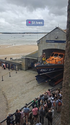 It’s always so amazing to see our volunteers spring into action the moment the pager goes off! Watch St Ives Lifeboat carefully launch the lifeboat before heading out to the rescue. Thank you to St Ives Tourism Association for capturing this moment 💙 [Visual description: An RNLI lifeboat is slowly transferred out of the St Ives Lifeboat Station. Volunteers in RNLI kit are onboard. A crowd is gathered alongside railings, with phones, capturing the moment.] #RNLI #Lifeboat #StIves #RNLIRescue | R