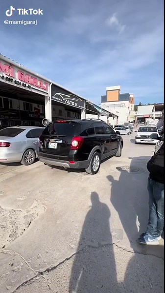 Exploring Unique Car Models in Daylight Parking Lot