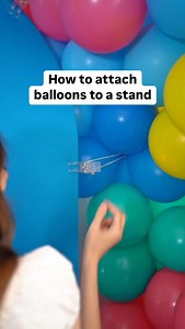 The EASIEST way to attach your balloons to a stand 🎈✨ Long skinny balloons work best, I like to tie the ends together to make a loop, then I slide that loop over one of my plastic clips. If you don’t have long skinny balloons, you can use a rubber band too (not as effective but it will still work!) #partyplanning #balloonartist #balloontips #balloontipsandtricks #balloons #balloondecor #balloontricks #balloontutorial #ballooneducation #partyideas #partydecorations #partydecor #DIY #hacks #birth