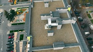 Aerial view of a Fire ventilation and smoke removal on the roof of a multi-story building. Overview of ventilation systems