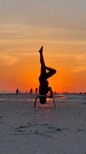 A stunning night at Fort Myers Beach. #sunset #fortmyersbeach #fortmyersbeachsunset #yoga #sunsetyoga #upsidedownyoga #feetup #feetupus #goldenhour | Sarah Bolen