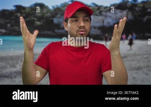 Courier man in red cap and t shirt shrugs hands and raises eyebrows in a studio setting; uncertainty frustration Stock Video Footage - Alamy