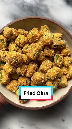 Southern Fried Okra! Recipe: - Approximately 20 fresh okra Batter - 3/4 cup milk - 1 egg Dredge - 1 cup all purpose flour - 1 cup yellow cornmeal - 2 teaspoons Kosher salt - 1/2 teaspoon paprika - 1/2 teaspoon garlic powder - 1/2 teaspoon onion powder - 1/2 teaspoon white pepper To fry and finish - Vegetable oil for frying - Flaky salt to finish #okra #friedokra #southernfood #sidedish #appetizer #okro