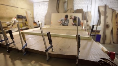 Crafting a unique river table using blue epoxy resin