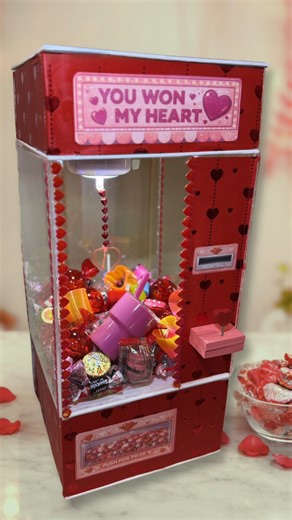This Valentine’s Day claw machine gift was made using Dollar Tree items. A playful DIY that turns a Valentine gift into an experience. | Crafty Beach