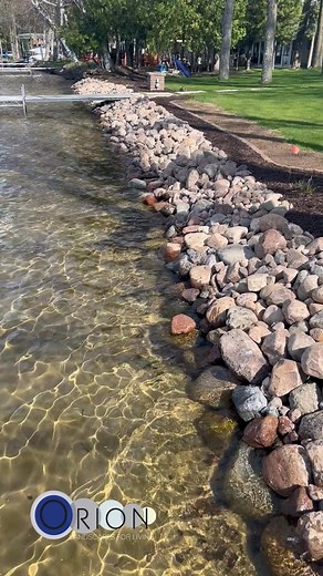 Check out this recent riprap installation—designed to protect against erosion while enhancing the natural look of the waterfront. Looking to protect your shoreline? Let’s talk! (715) 460-3439 | Orion Landscapes For Living