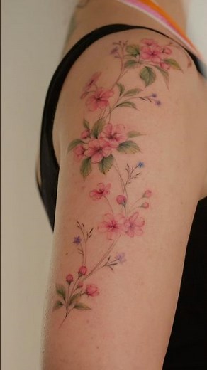 A flower tattoo on a girl's arm. A beautiful and feminine tattoo by @kottattoostudio.