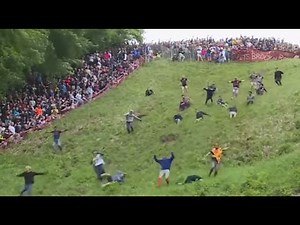 Men Race Down A Hill for Cheese