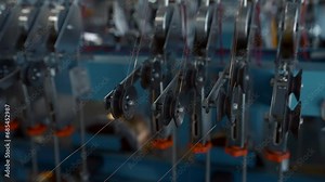 Copper wire cable production in coils at the metal steel industrial plant. Creative. Metal wire spool spinning machine.