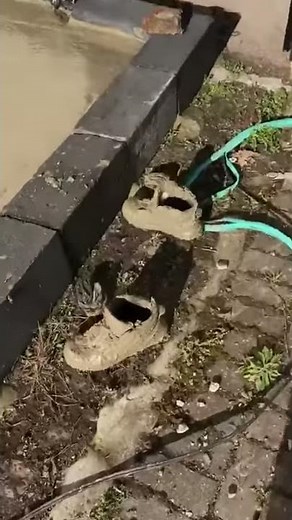 Man walking barefoot in wet concrete