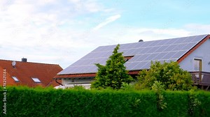 Solar panels on the roof of a house. Renewable clean energy from sunlight. Green energy at home.solar power technology. 4k footage