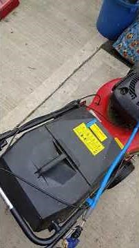 Champion 40 self propelled petrol lawn mower in action