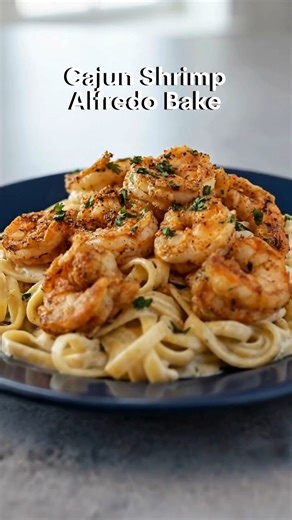 Cajun Shrimp Alfredo Bake If you love creamy, cheesy Alfredo pasta but crave a little heat… this Cajun Shrimp Alfredo Bake is about to be your new obsession. This is the kind of dish that makes people go back for seconds… and ask for the recipe before they even finish their plate. ⏱ Prep Time: 15 minutes ⏱ Cook Time: 25 minutes 🍽 Servings: 4–6 🛒 Ingredients For the Shrimp: 1 lb large shrimp, peeled & deveined 1–2 tbsp Cajun seasoning 1 tbsp olive oil 1 tsp paprika (optional for extra color) 1 