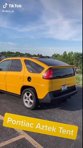 Pontiac Aztek tent! #pontiac #Aztek #Tent #camping #uglycar #yellowcar #tech #cartent #coolcar #Aztec #Versatile #carcamping #awd #suv #gm