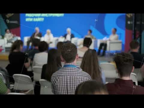 Audience attending a panel discussion at a conference or seminar