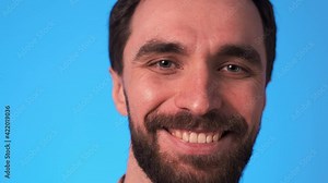 The close up view on blinking man face. slow motion