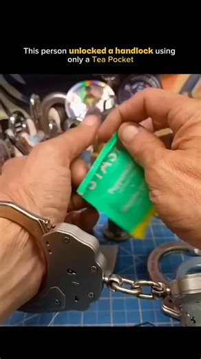 Mind sparked on Instagram: "A basic handcuff is shown being opened with nothing more than a tea bag, highlighting how some low-security restraints depend on loose internal tolerances. 🫖🔓 Thin, flexible materials can sometimes slip into the mechanism without force or visible damage. The clip shows how the internal ratchet or pawl can be manipulated due to simple mechanical design, not because of brute strength or advanced tools. ⚙️🧠 This works only on cheap or poorly designed restraints, not o