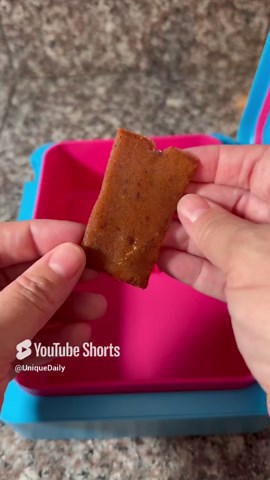 Packing school lunch as mom eats daughter’s lunch
