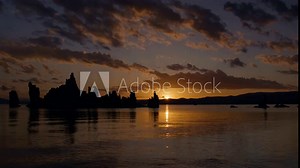 Tufa rock formations on Mono Lake in Eastern Sierra area of California at sunrise with sun shining