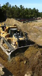 CAT D11T bulldozers demonstrate coordinated teamwork and full power while pushing overburden. #CATD11T #BulldozerLife #fblifestyle #MiningLife #HeavyEquipment #Earthmoving | HeavyBuild Project