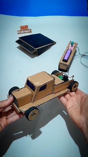 handmade rc car wired with cardboard and dc motor
