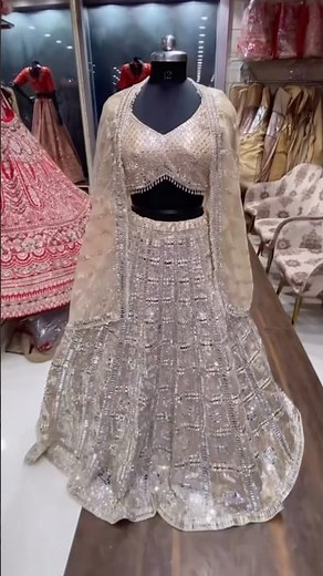 It appears to be a shimmering silver/light gold/champagne color giving a modern look🫣#fyp #lehenga