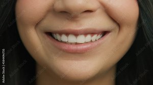 Happy Smiling People Close-up Concept. Casual female with healthy skin and beautiful white teeth smiling cheerfully and background of pink lips. Expressive emotional fun and joy lifestyle concept 4K