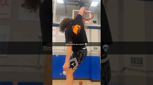 Dunk gone wrong: arm gets stuck in hoop!
