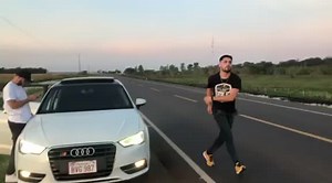Dance Routine by a Parked Audi Car