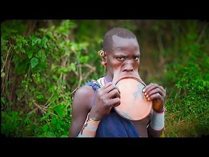 Suri tribe woman with large lip plate Omo Valley Ethiopia