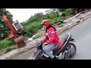 girl in red driving on flat tire