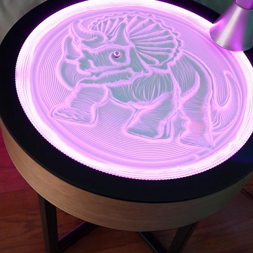 Transform your living space into a serene retreat with the Oasis Side Table. Watch as a tiny ball glides beneath the surface, crafting calming sand patterns. With app control, you can change the design anytime, turning your table into a living work of art that relaxes and captivates. | Grounded Labs