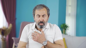 Coughing middle-aged man.