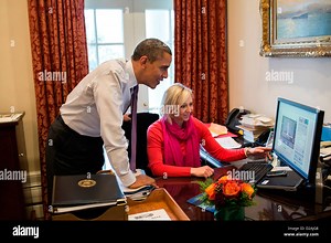 US President Barack Obama and Personal Secretary Anita Decker watch a video on the computer of former advisor David Axelrod shaving off his mustache December 7, 2012 in Washington, DC Stock Photo - Alamy