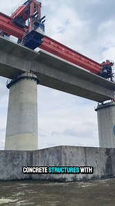 This colossal launching gantry effortlessly lifts and maneuvers massive concrete structures. | LOUIE ONG