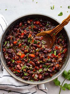 Recipe here: https://therecipecritic.com/cuban-black-beans/ Made with minced red onion, bell peppers, and aromatic garlic, these Cuban black beans simmered in a blend of tasty spices and red wine vinegar create a mouthwatering experience that will have you craving seconds. | Tried and True Recipes