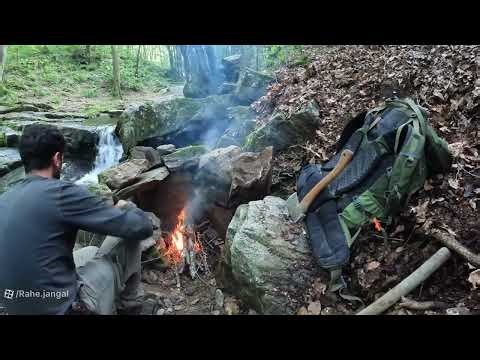 Camping and construction of wooden and mud huts in the forest under storm and rain