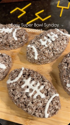 Remy Johnson on Instagram: "Football Rice Krispies🏈 the perfect easy dessert to make for Super Bowl Sunday!!✨ Ingredients: 3 tablespoons of butter 1 bag of marshmallows 6 cups of cocoa pebbles White icing Recipe: Melt butter over low heat, once melted add the bag of marshmallows. Stir until completely melted. Remove from heat and add the cocoa pebbles. Put into a greased 9x13 pan and press down with wax paper. Let cool and then cut into football shapes. Add white icing for the laces and enjoy!!