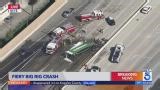 Big rig crashes through center divider, bursts into flames on 57 Freeway in O.C.