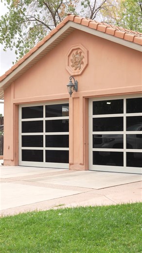 Before and After. This home built in the early 90's and had its orignal Stanley garage doors still up. The first thing you see when you pull up to this house, is the garage doors. Talk about a face lift. These were custom powder coated to match soffit and faccia. | Moenave Garage Doors