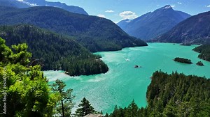 Diablo Lake in North Cascades National Park. Scenic nature view over Diablo lake. Diablo lake with mountain landscape. Landscape of mountain peak and Diablo lake. Nature landscape. Emerald water