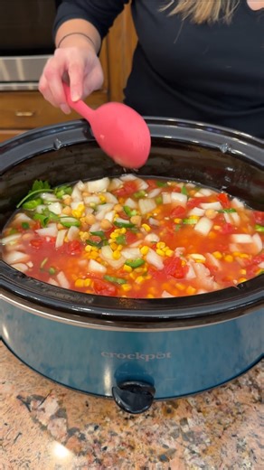 Cozy crockpot chicken and bean soup Olivia uses chicken, diced tomatoes, corn, onion, jalapenos, garlic, garbanzo beans, seasonings, chicken broth, cilantro, cream cheese and pepper jack cheese to make a yummy soup. This original video was produced by Network Media LLC and Olivia | Olivia