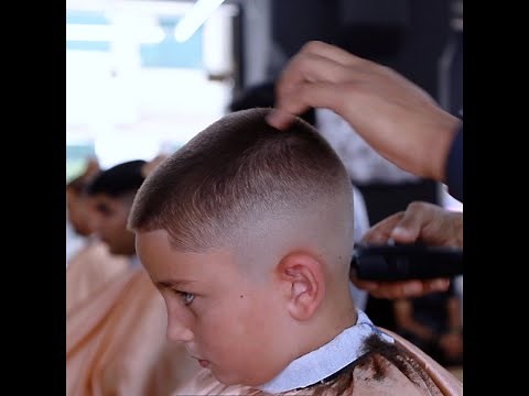 Blue eye kid get a buzz cut
