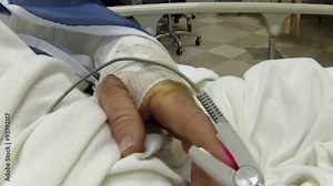 Patient's hand with oxygen sensor in hospital HD 001