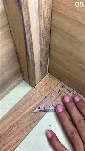 Ruler aligns, pencil guides—corner takes shape in the quiet geometry of joinery and intent
