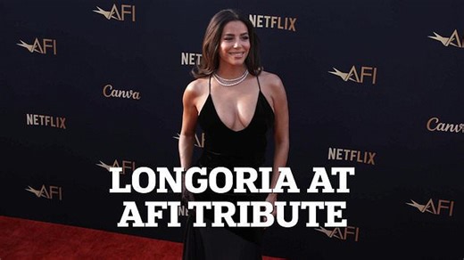 Eva Longoria in a low-cut gown at Eddie Murphy's AFI tribute