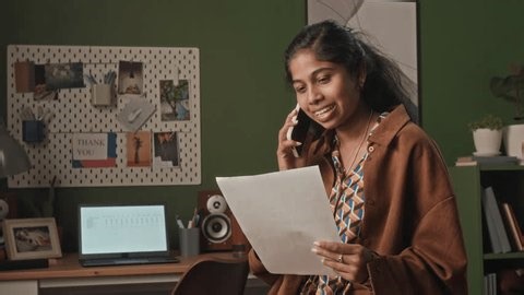 clip-3996506347-medium-shot-cheerful-multiethnic-female-remote-worker